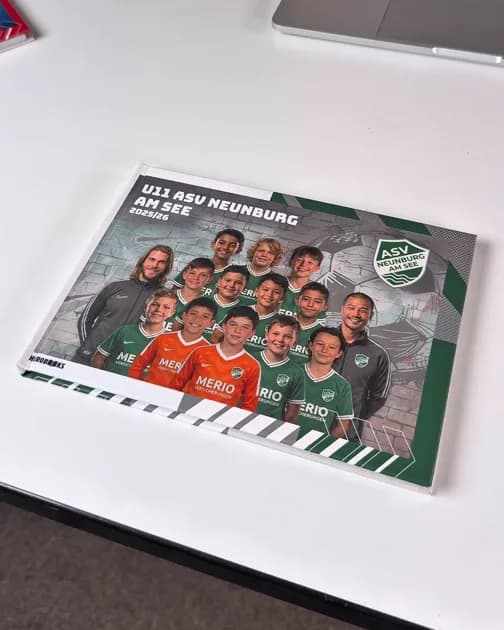 Finished team book with the squad photo on the cover